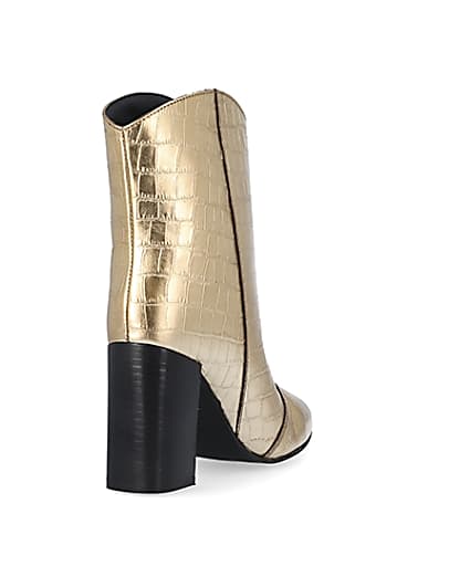 360 degree animation of product Gold metallic croc embossed ankle boots frame-11