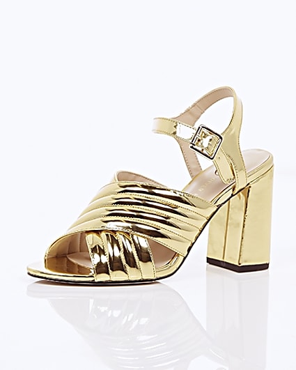 360 degree animation of product Gold patent cross strappy heels frame-0
