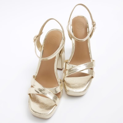 Gold wide fit crossed strap heeled sandals River Island