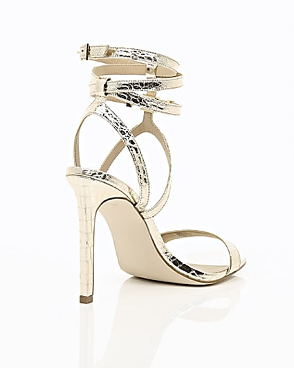 360 degree animation of product Gold wide fit metallic caged strappy sandals frame-13