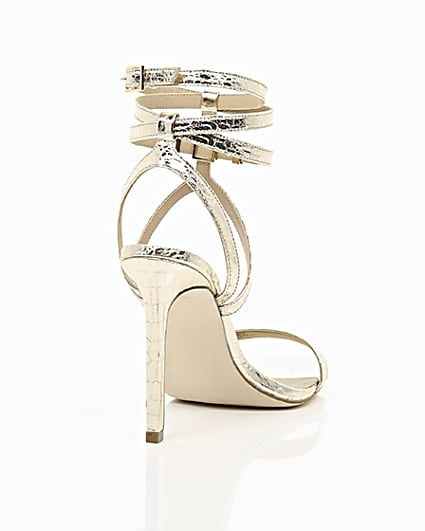 360 degree animation of product Gold wide fit metallic caged strappy sandals frame-14