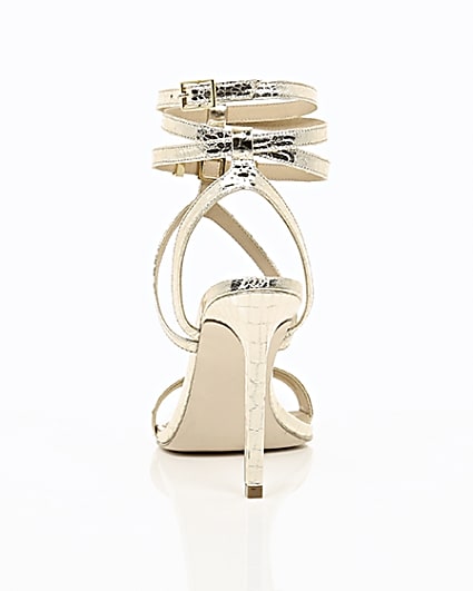 360 degree animation of product Gold wide fit metallic caged strappy sandals frame-16
