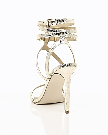 360 degree animation of product Gold wide fit metallic caged strappy sandals frame-17