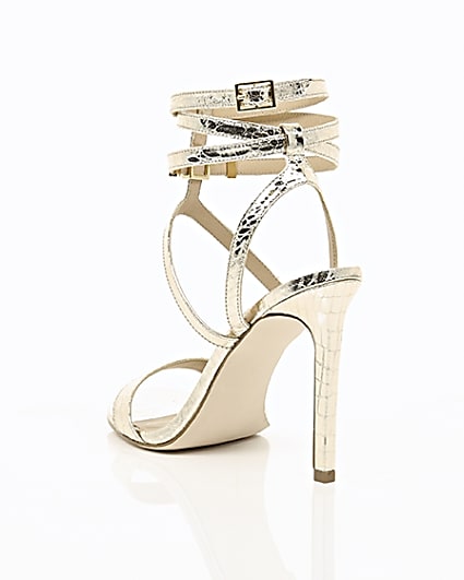360 degree animation of product Gold wide fit metallic caged strappy sandals frame-18