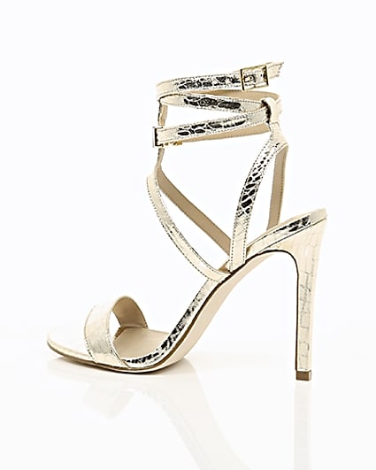 360 degree animation of product Gold wide fit metallic caged strappy sandals frame-20