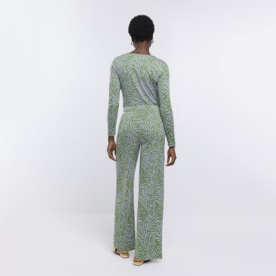 Green animal print wide leg trousers