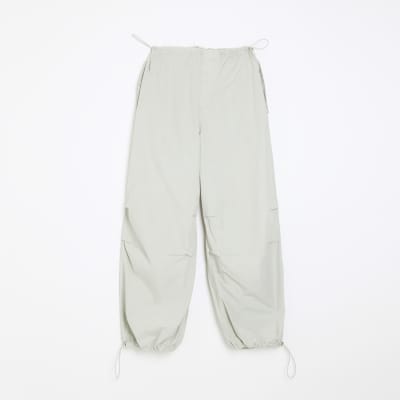 Green baggy low rise parachute trousers