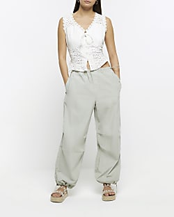 Green baggy low rise parachute trousers