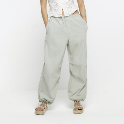 Green baggy low rise parachute trousers