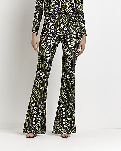 Green floral print flared trousers