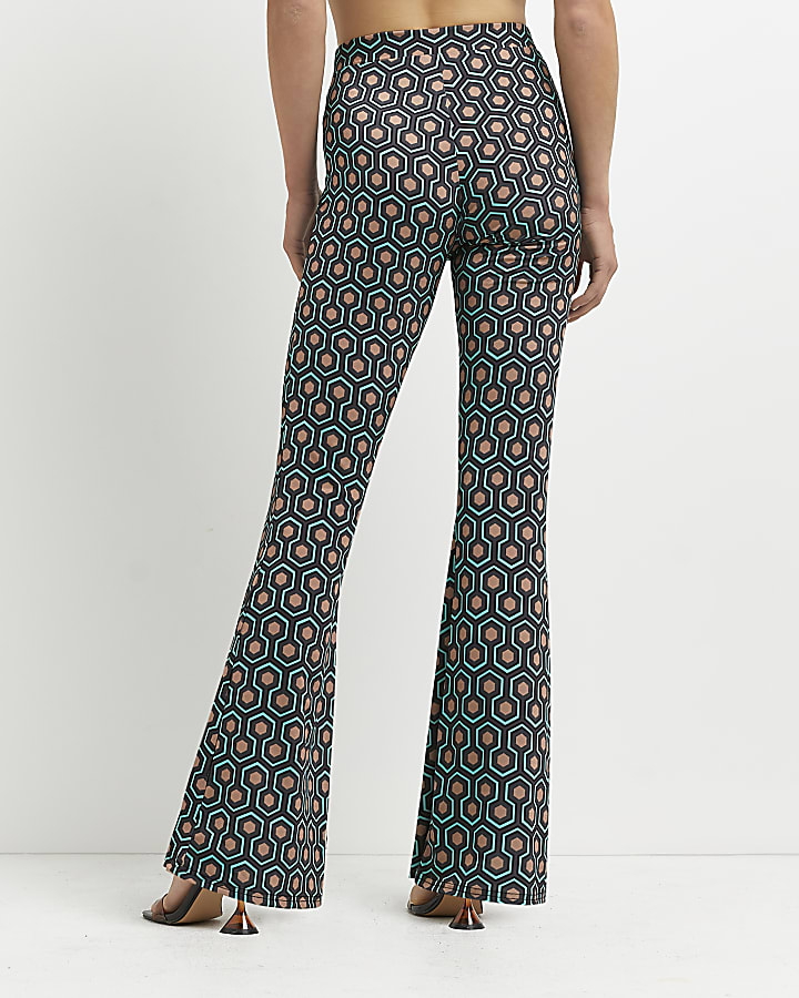 Green geometric print flared trousers
