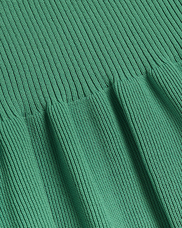 Green knit peplum jumper
