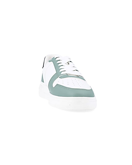 360 degree animation of product Green low top trainers frame-20