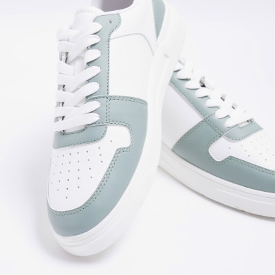 Green low top trainers