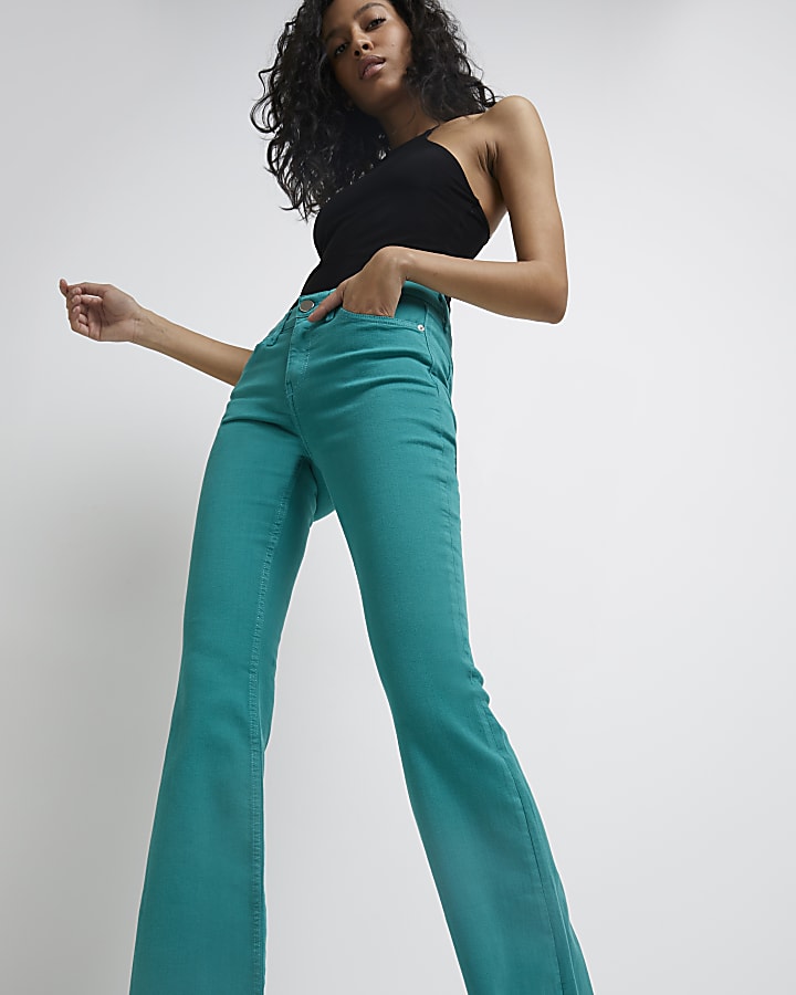 Green mid rise flared jeans