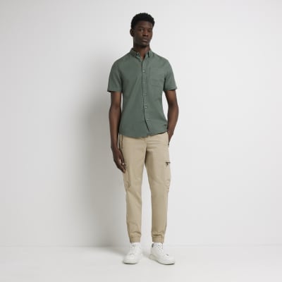 beige pants green shirt