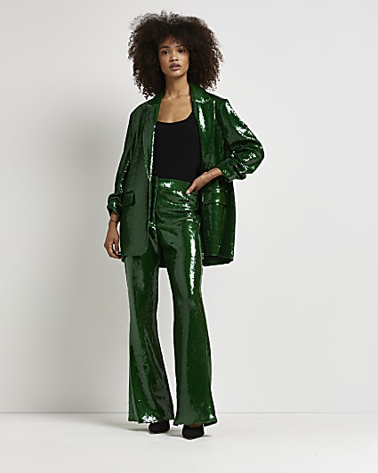 Green sequin flared trousers