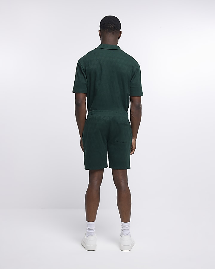Green slim fit textured shorts