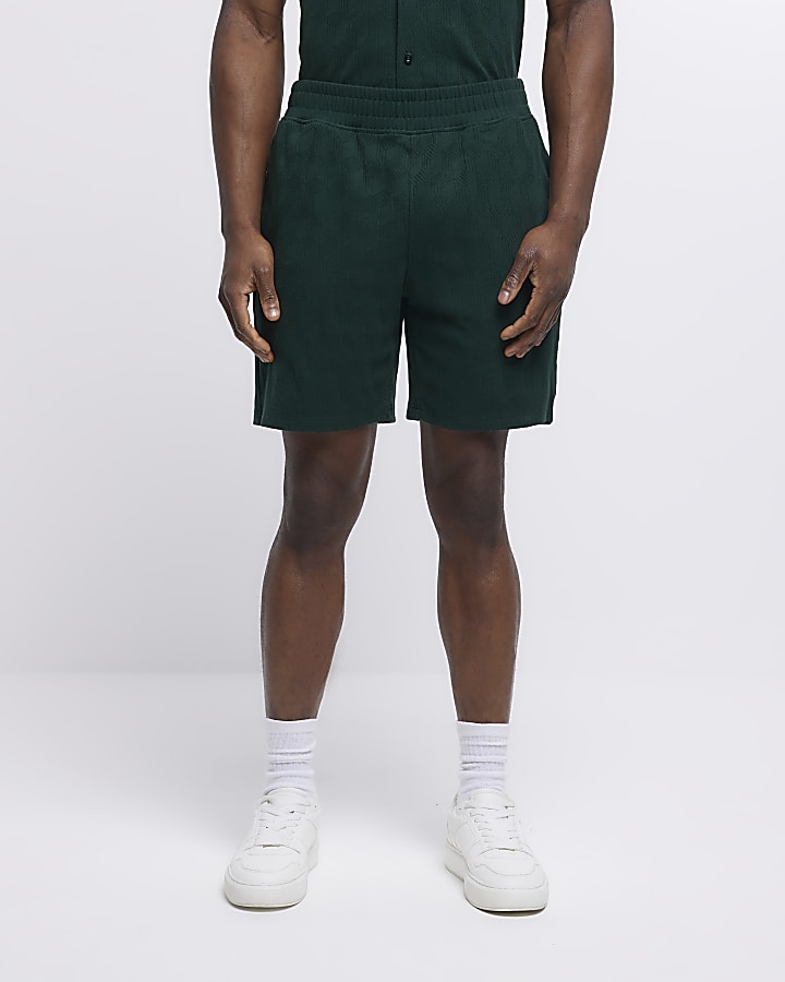 Green slim fit textured shorts