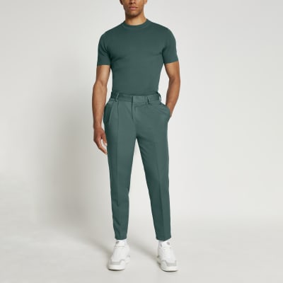 green tapered trousers