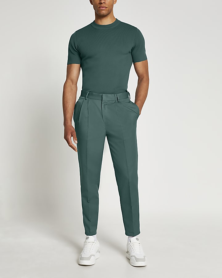 Green tapered pleat trousers