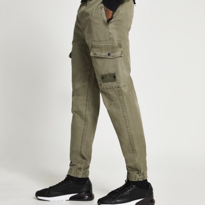 Green washed cargo trousers | River Island