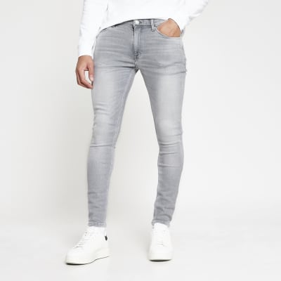 spray on grey jeans