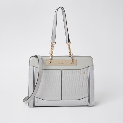 grey patent bag