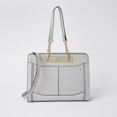 grey patent handbag