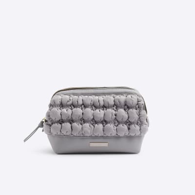 Grey quilted makeup bag