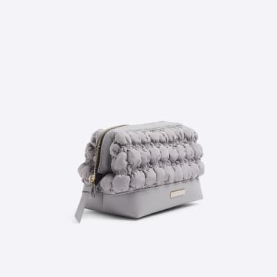 Grey quilted makeup bag