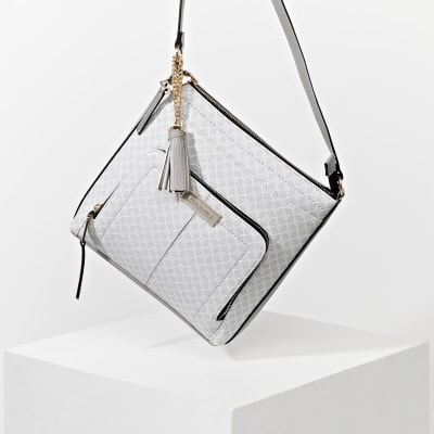 Grey RI monogram messenger bag River Island