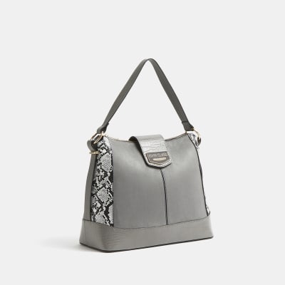 coach bag with purple flowers