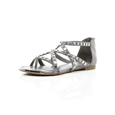 360 degree animation of product Grey studded metal gladiator sandals frame-0