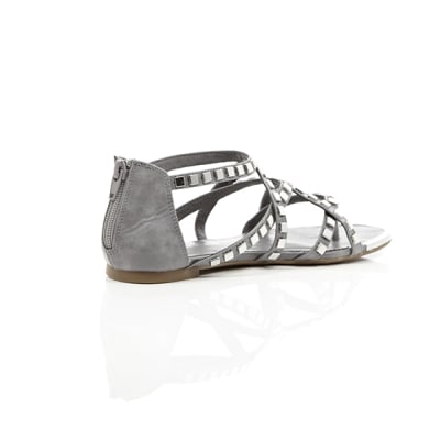 360 degree animation of product Grey studded metal gladiator sandals frame-12