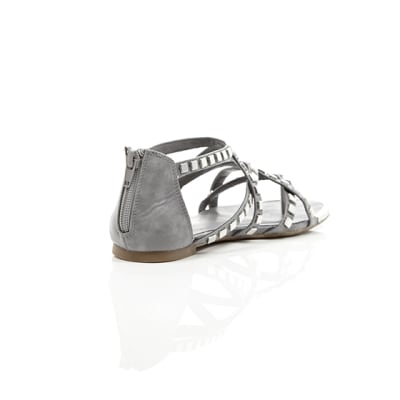 360 degree animation of product Grey studded metal gladiator sandals frame-13
