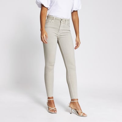 beige high waisted skinny jeans