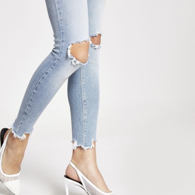 Light blue ripped Molly mid rise jeggings