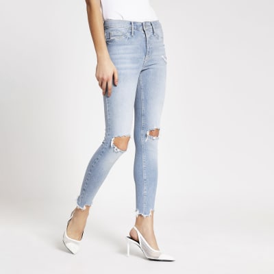Light blue ripped Molly mid rise jeggings