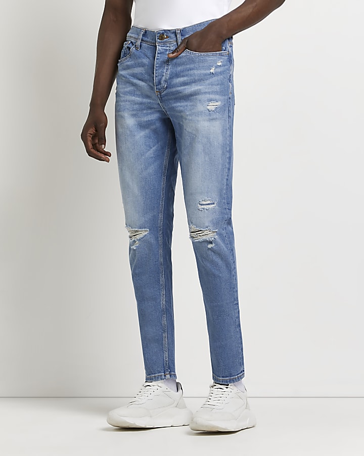 Light blue ripped tapered jeans