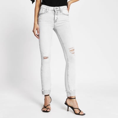 grey mid rise skinny jeans