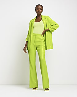 Lime green sequin flared trousers