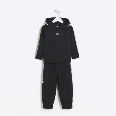 Mini boys black taped hoodie and joggers set River Island