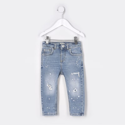 Mini boys blue paint design skinny jeans | River Island