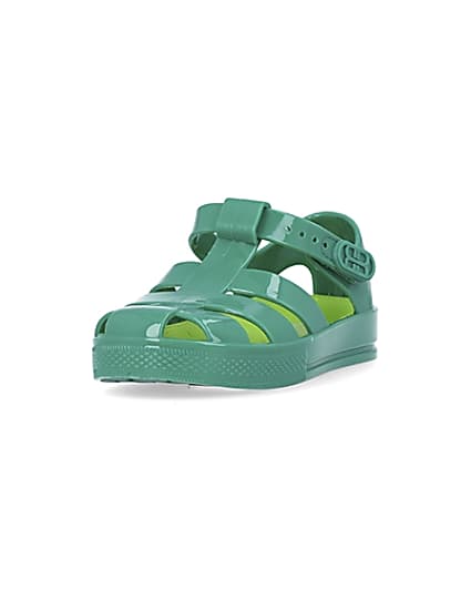 360 degree animation of product Mini boys green caged jelly shoes frame-23