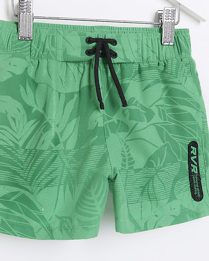 Mini boys green print reveal swim shorts
