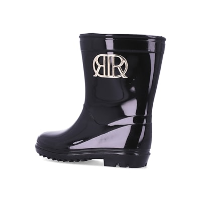 Mini girls black RI branded wellie boots | River Island