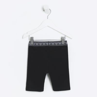 Mini girls black RI rib cycle shorts River Island