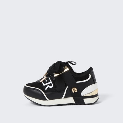 girls black and gold trainers