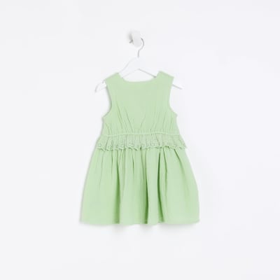 Mini girls green broderie detail peplum dress
